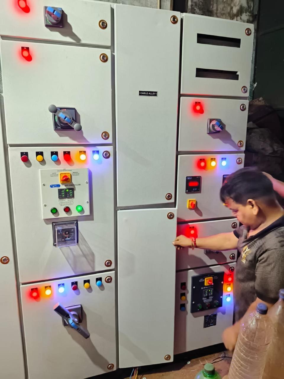 Engineer wiring an AMF control panel at the AM Electricals workshop